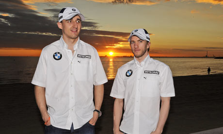 Nick Heidfeld and Robert Kubica at St. Kilda beach in Melbourne