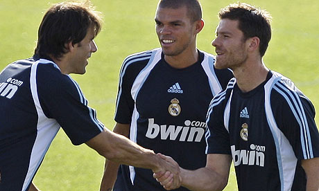 Real Madrid's new signing Xabi Alonso greets Ruud van Nistelrooy with a