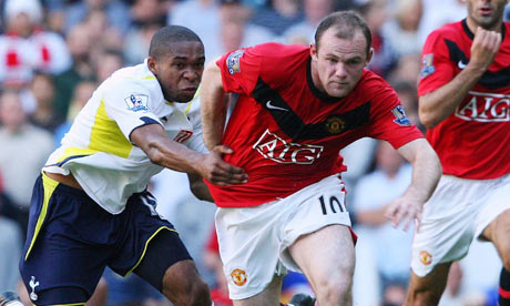 Wayne Rooney tussles for the ball