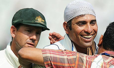 Ricky Ponting, left, looks on as VVS Laxman is congratualted by an Indian official