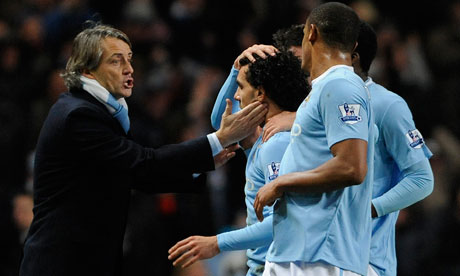 Roberto Mancini and Carlos Tevez