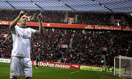 Arjen Robben celebrates scoring for Bayern Munich against Bayer Leverkusen