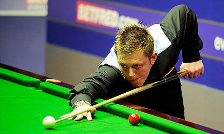 Mark Allen plays a shot during his match against Mark Davis at the World Snooker Championship