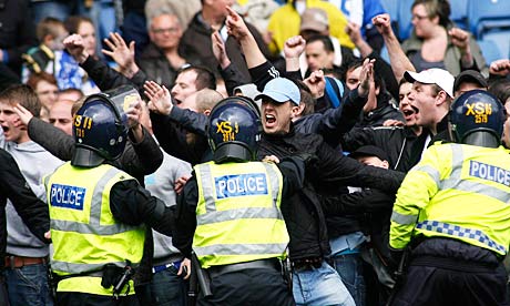 Fans clash with riot police