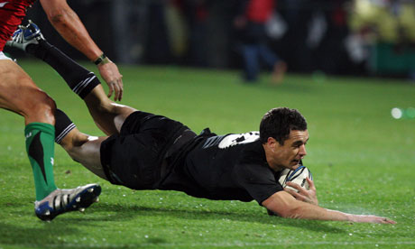 New Zealand's Dan Carter scores one of his two tries in the 42-9 defeat of Wales at Carisbrook.