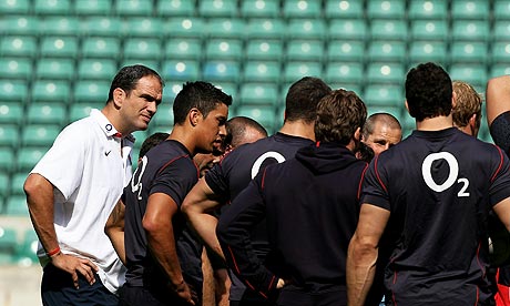 Martin Johnson looks on as his England squad train at Twickenham today