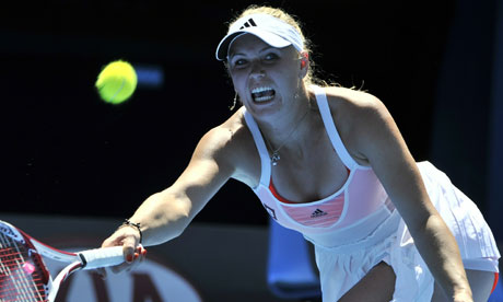 Caroline Wozniacki 2011 Australian Open Photos. Caroline Wozniacki returns to