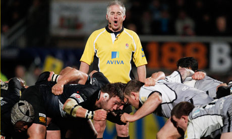 Referee Chris White looks over a scrum as Wasps take on Newcastle in the Premiership