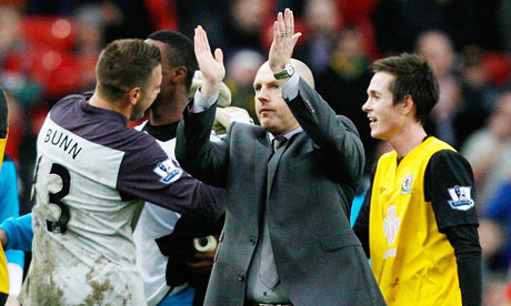 Steve Kean acknowledges the crowd at Old Trafford