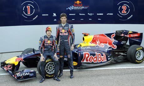 Sebastian Vettel and Mark Webber with Red Bull's 2011 car