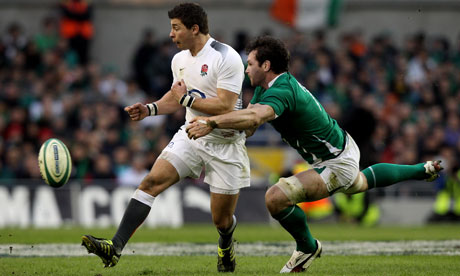 Scrum-half Ben Youngs loses the ball as he is tackled by David Wallace during Ireland's victory