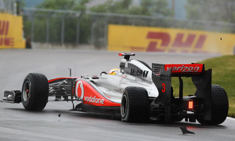 Lewis Hamilton's rear left wheel is damaged after colliding with Jenson 