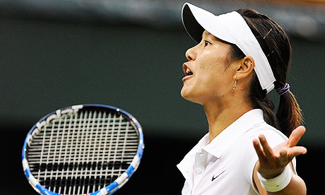 Li Na looks dejected on her way to defeat to Sabine Lisicki on Centre Court