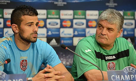 FC Cluj's defender Cadu and the team's coach Ioan Andone 