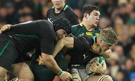 Ireland's Jamie Heaslip is tackled by South Africa's Willem Alberts in Dublin
