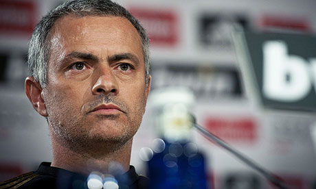 Poker face: Real Madrid boss Jose Mourinho keeps his cards close to his chest over whether he will leave the club for pastures new.