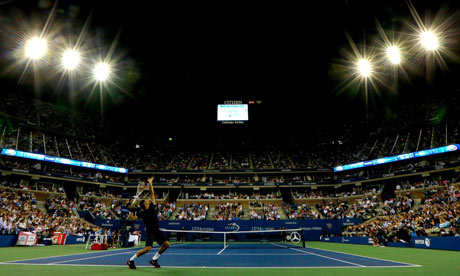Roger Federer serves against Donald Young
