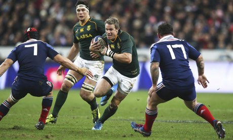 South African captain Jean de Villiers runs at the French defence during his side's win in Paris.