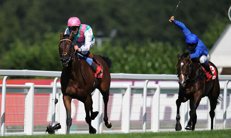 Kingman, ridden by James Doyle, surges clear to win the Solario Stakes at Sandown Park