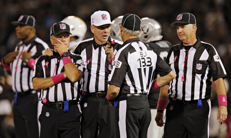 An NFL officiating crew discuss a play between the San Diego Chargers and the Oakland Raiders.