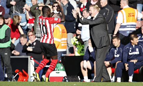 Southampton's Sadio Mané celebrates with manager Ronald Koeman after scoring against Stoke City