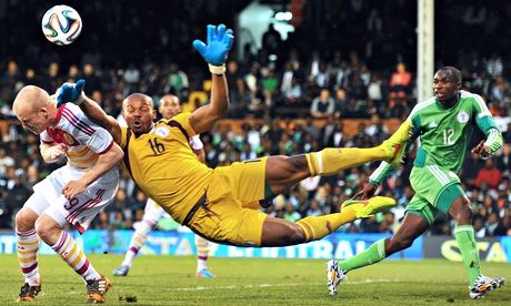 Nigeria's goalkeeper Austin Ejide vies with Scotland's striker Steven Naismith during the internatio