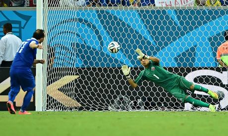 Costa Rica's goalkeeper Keylor Navas saves from Greece forward Fanis Gekas in the penalty shoot-out 