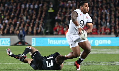 Manu Tuilagi of England is tackled by New Zealand's Conrad Smith during the Test match at Eden Park