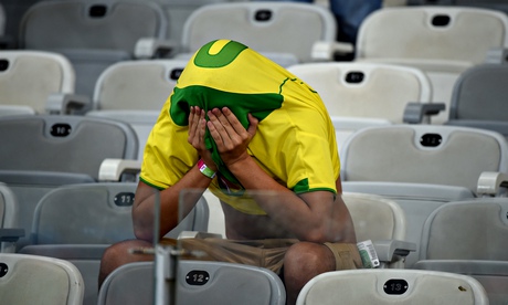 A Brazilian fan contemplates his national team's 7-1 defeat against Germany in Belo Horizonte. 