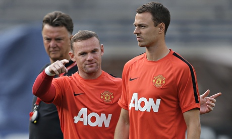 Wayne Rooney and Jonny Evans