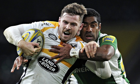 Wasps' Elliot Daly is tackled by Asaeli Tikoirotuma of London Irish in the Premiership match