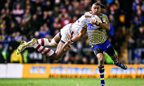Warrington's Kevin Penny is tackled by St George's Eto Nabuli at the Halliwell Jones Stadium on Frid