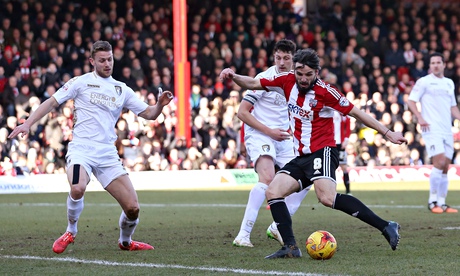 Brentford's Jonathan Douglas, right, scores the first goal against Bournemouth in the Championship