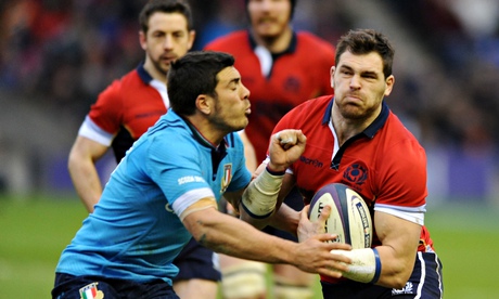 Scotland's Sean Lamont, right, is tackled by Edoardo Gori of Italy in the Six Nations match