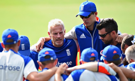 The England coach, Peter Moores, centre, gathers his players round during a nets session in Sydney