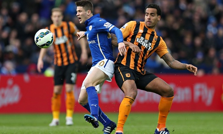 Hull's Tom Huddlestone, right, challenges Leicester's Andrej Kramaric in the Premier League 