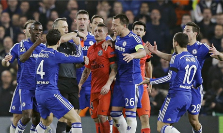 Chelsea players surround the referee Bjorn Kuipers during last week's match against Paris St Germain