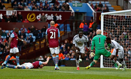Swansea's Bafétimbi Gomis, centre, celebrates against Aston Villa in the Premier League