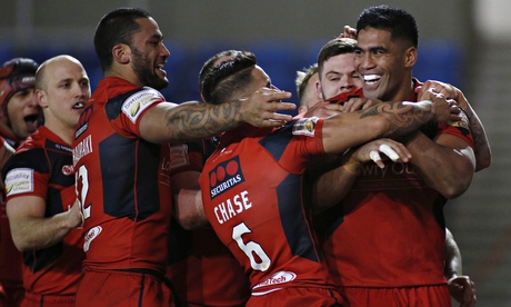 Lama Tasi, right, celebrates with his Salford Red Devils team-mates after his try against Widnes