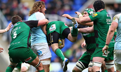 Newcastle's Josh Furno, second left, upends Chris Noakes of London Irish – a yellow-card offence