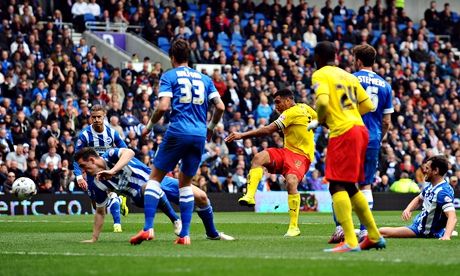 Watford's Troy Deeney scores the first goal against Brighton in the Championship match at the Amex