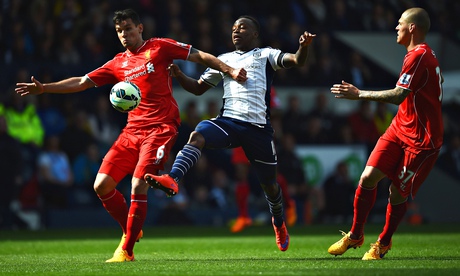 Liverpool's Dejan Lovren and Victor Anichebe of West Brom compete in the Premier League