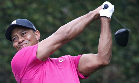 Tiger Woods hits a tee shot on the second hole of the second practice round for the Masters