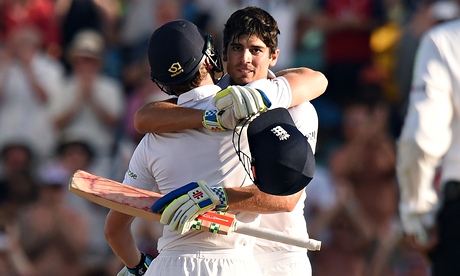 England captain Alastair Cook is congratulated by Jos Buttler after reaching his century on the firs
