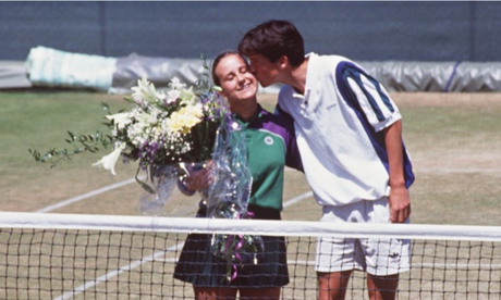 Tim Henman kisses ballgall Caroline Hall after he accidentally hit her with a ball in 1995 doubles