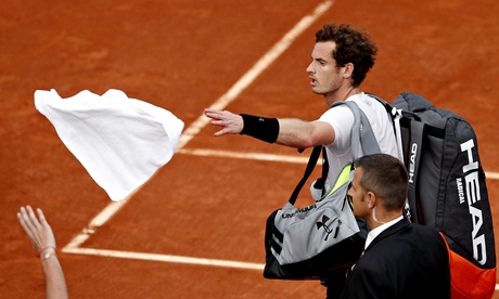 Andy Murray leaves the court after bad weather halted his French Open semi against Novak Djokovic