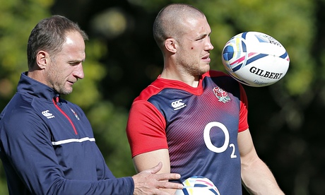 England's attacking skills coach, Mike Catt, left, plays ball alongside Mike Brown in training