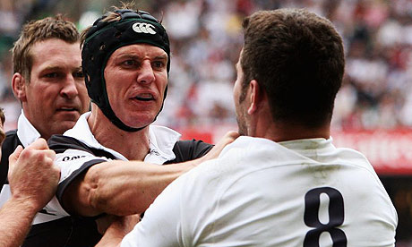 Stephen Larkham gets up close and personal with Nick Easter