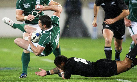 Robert Kearney of Ireland is tackled by Anthony Tuitavake