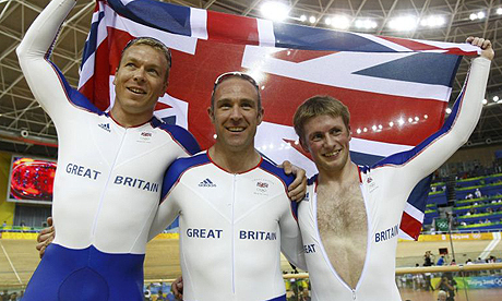 Britain's Chris Hoy, Jamie Staff and Jason Kenny celebrate winning gold in the team sprint